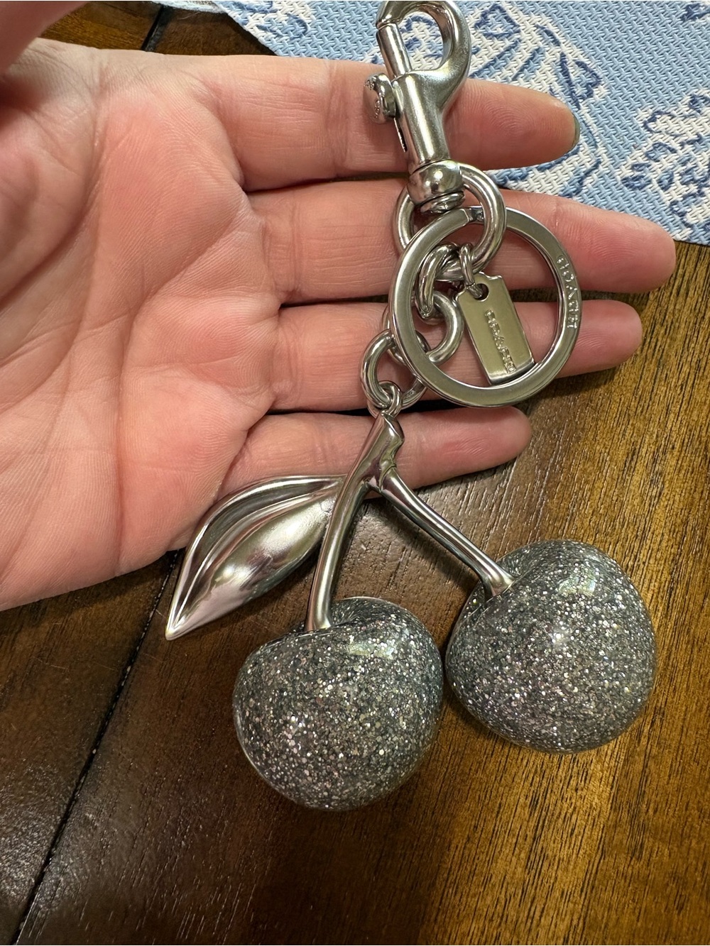 Coach Silver glitter cherry bag charm